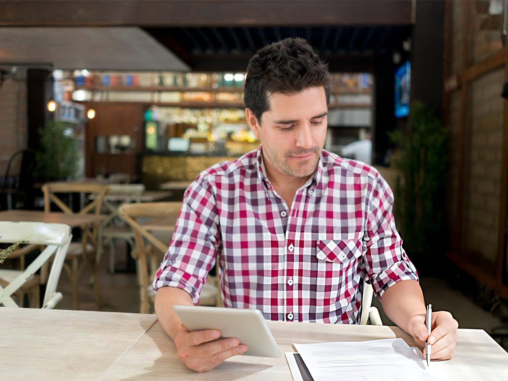 man taking notes